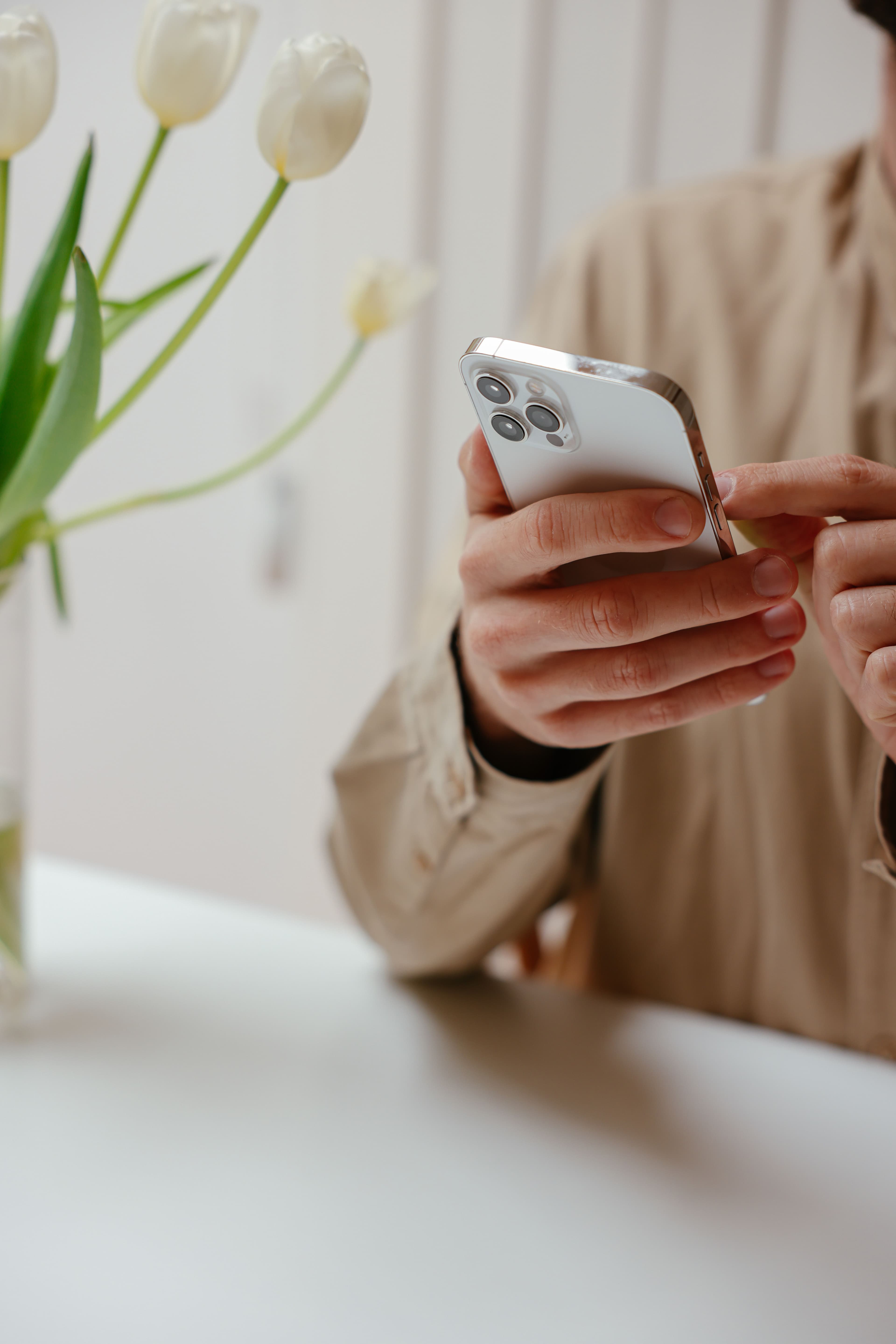 Person using an iOS app on iPhone